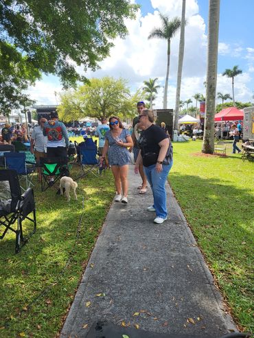 Jill speaks with neighbors at the Sugar Festival