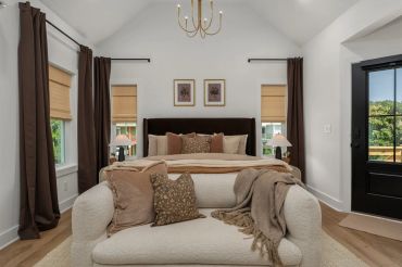 Cozy bedroom with neutral tones and elegant decor.