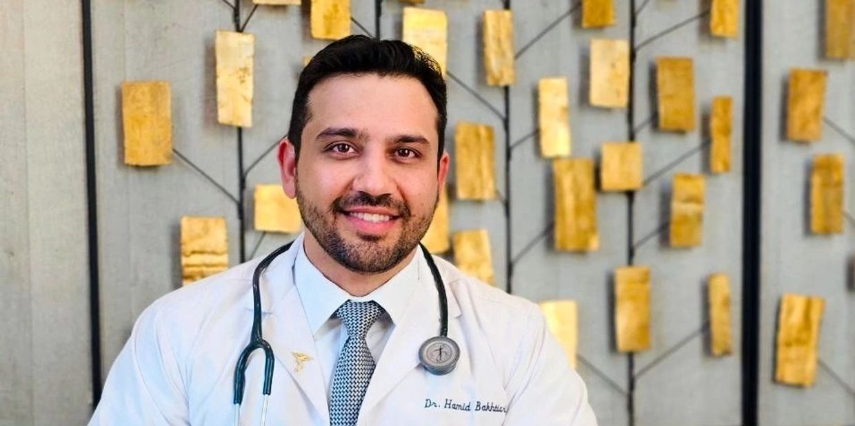 Portrait of a smiling male doctor with a stethoscope.