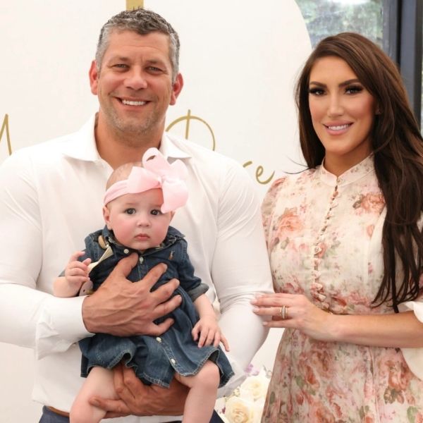 Family portrait with father, mother, and baby girl.
