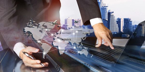 A businessman interacts with a logistics network map overlay.
