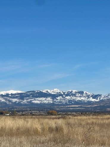 Snowy mountains under a clear blue sky.