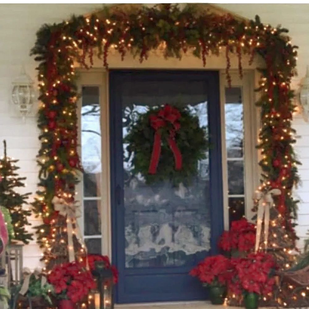 Front Exterior Entrance  with Green garland and Christmas decoration.