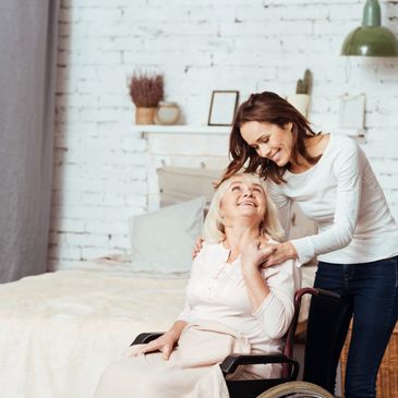 Home Heatlh Care Therapist and Patient in the Patients home sharing a laugh