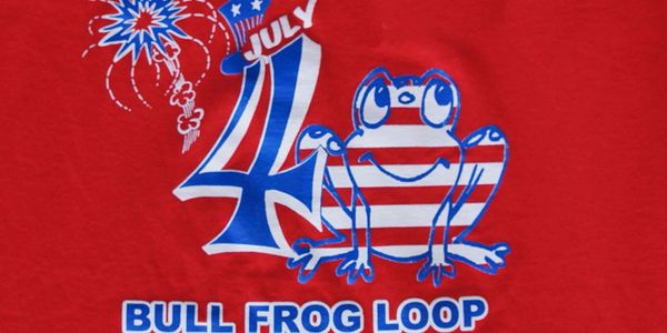 Red t-shirt with 4th of July frog and fireworks design.