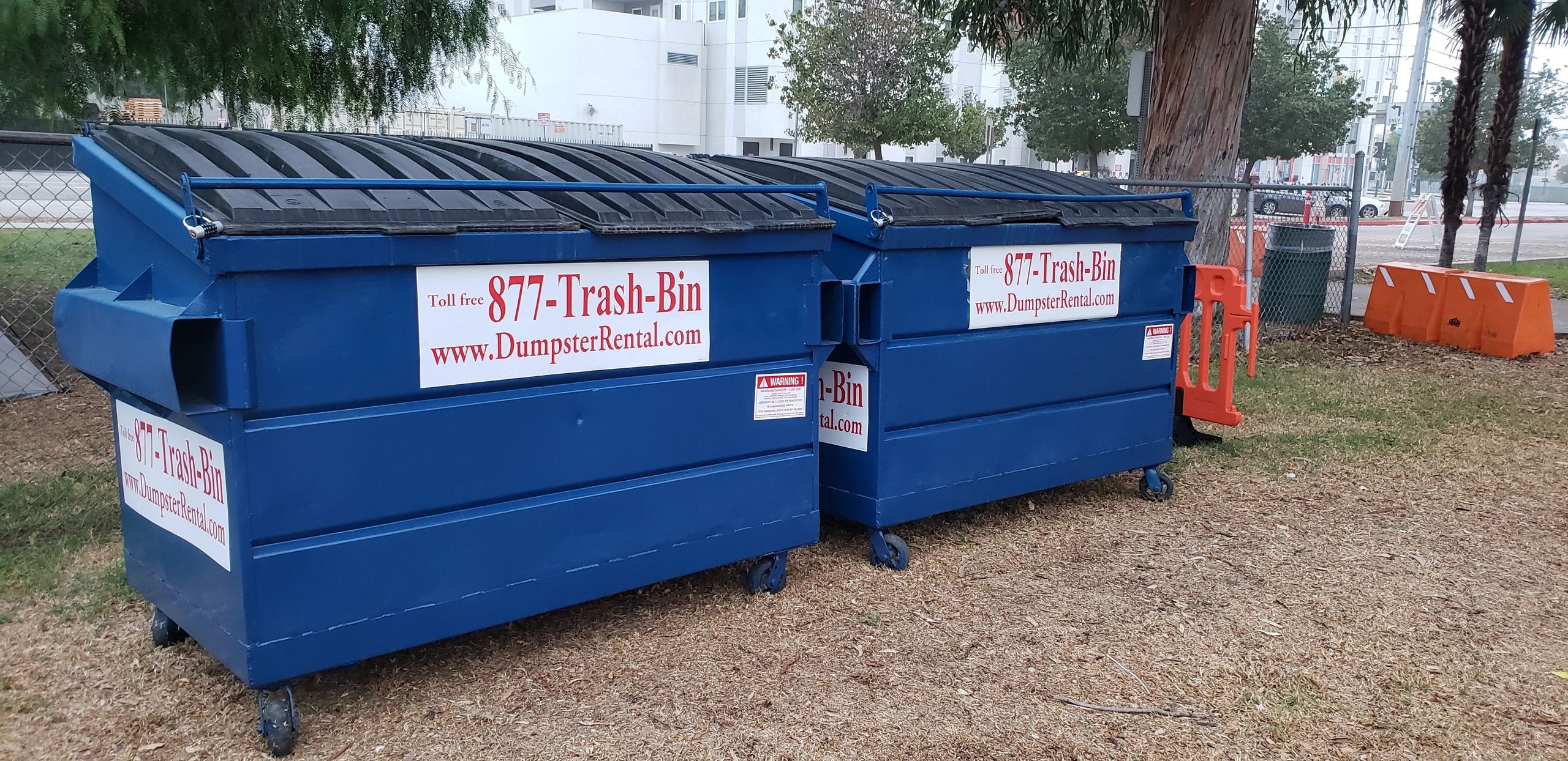 2 dumpsters with trash-bin label on them