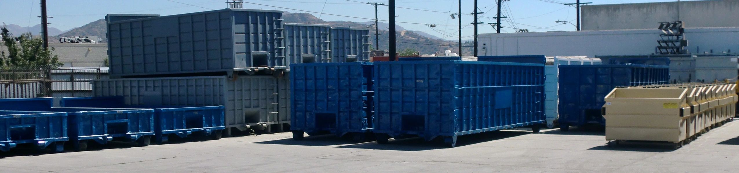 Blue roll-off dumpsters from Dumpster Rental, Inc.