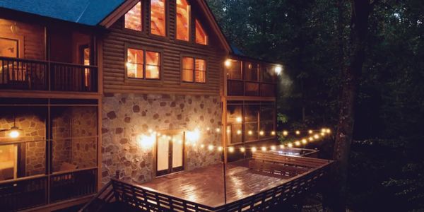 String lights decorate ack porch of vacation rental cabin in the Great Smoky Mountains 