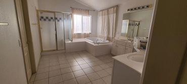 BEFORE Master bathroom renovation Las Vegas  double vanity and frameless shower enclosure by Vegas P