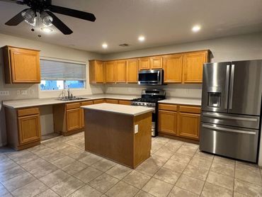 Before kitchen remodel Las Vegas - original oak cabinets and tile floors by Vegas Pro Remodeling