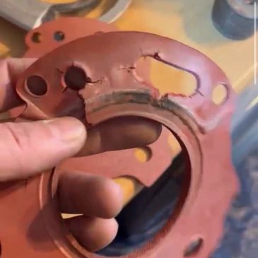 Boiler service inspection revealing cracked internal gasket