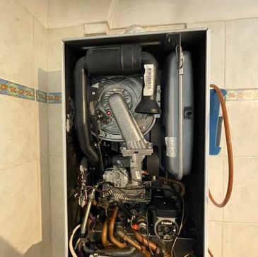 Boiler fully reassembled and rebuilt after heat exchanger replacement, ready for testing and safe op