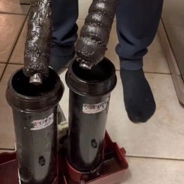 Magnetic rods showing sludge collected from heating system during MagnaCleanse power flush