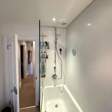 New bath and shower mixer tap installed in clean modern bathroom