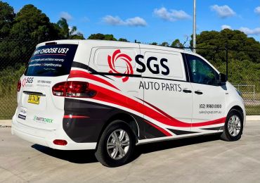 SGS Auto Parts service van with branding and contact information.
