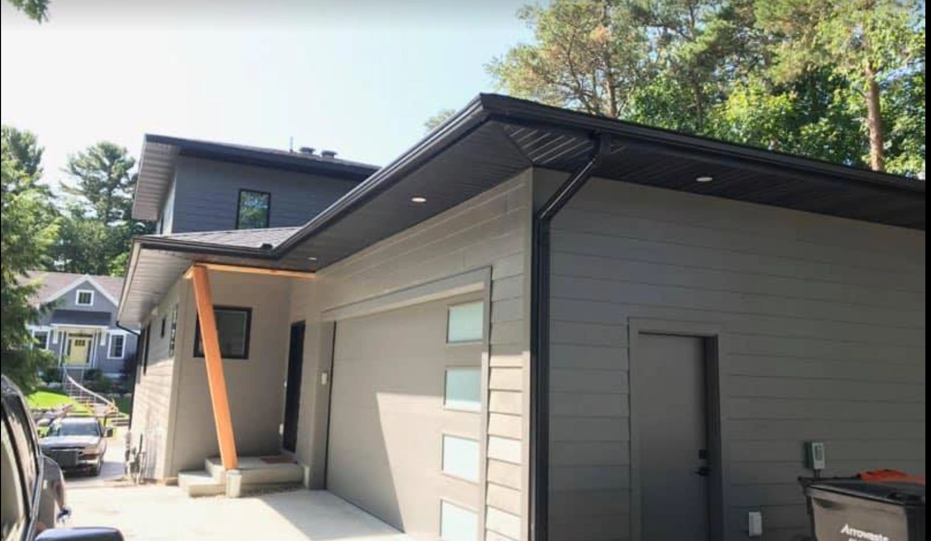 black seamless gutter on a modern home in holland michigan