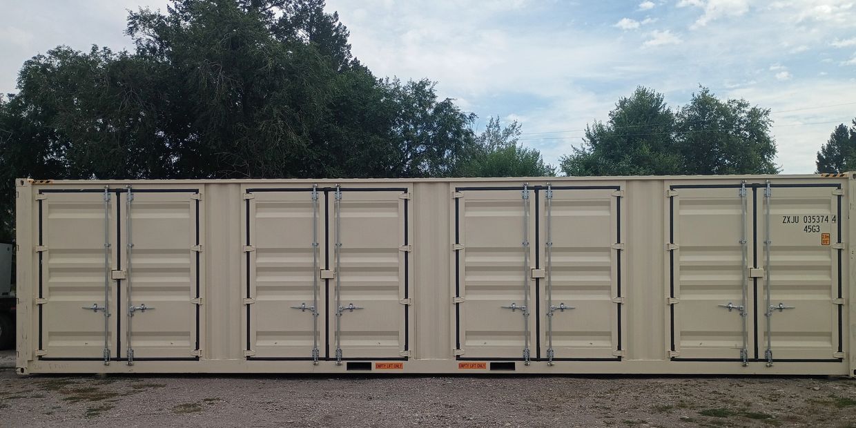 Large beige shipping container with multiple doors.