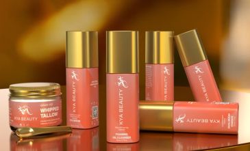 Kya Beauty skincare products with gold caps and pink labels.