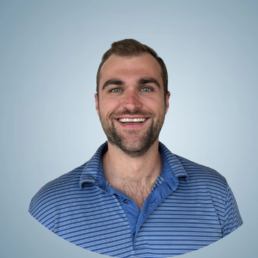 Smiling man in a blue striped polo shirt against a light blue background.