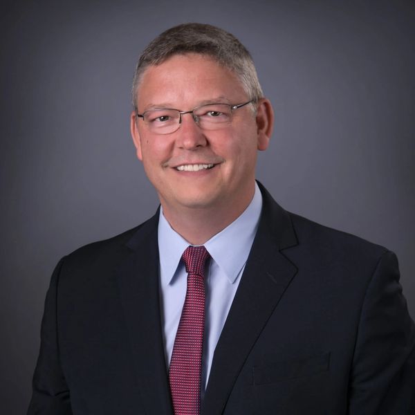 Picture of Billy Daugherty in a suite and tie.
