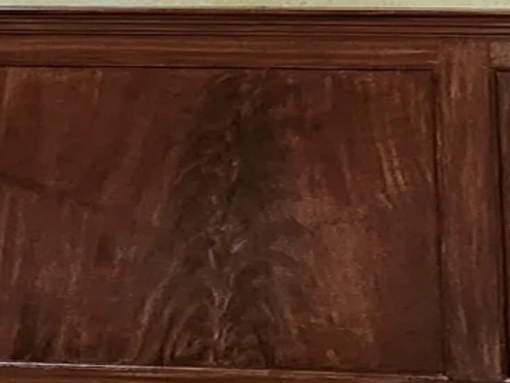 Metallic glazed wall, custom-made artwork, woodgrain wainscot, and trim by ONeal Studios..