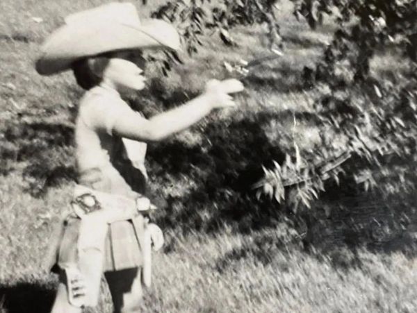 a black and white picture of a small boy