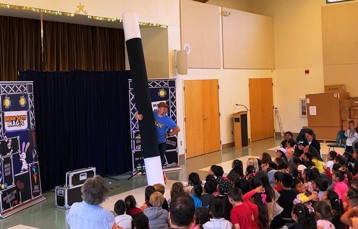 School performer Magcian Brian Scott performs for a group of school children