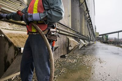 A Man cleaning the wall