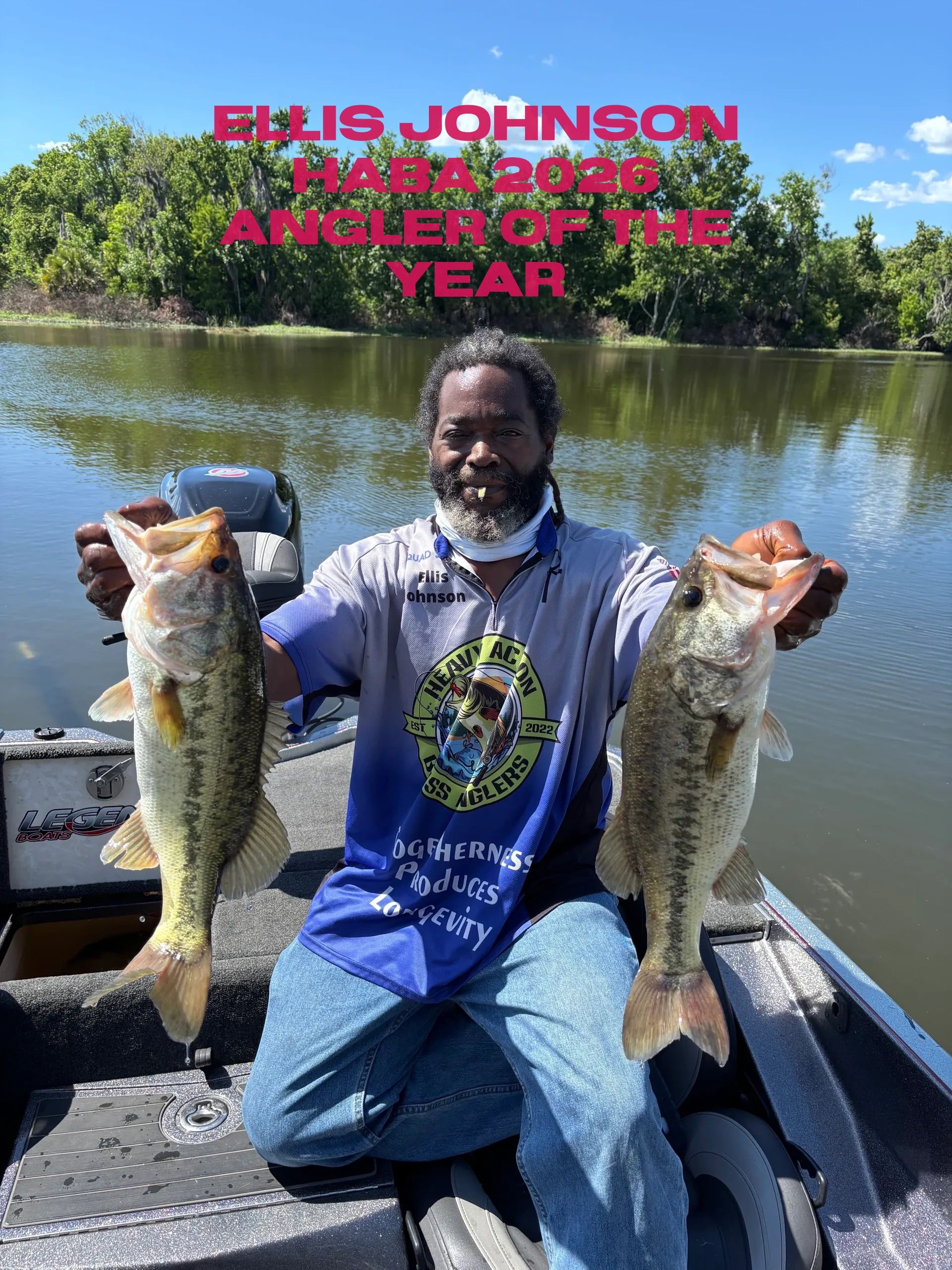 Ellis Johnson proudly holds two large fish, showcasing his 1st place win.