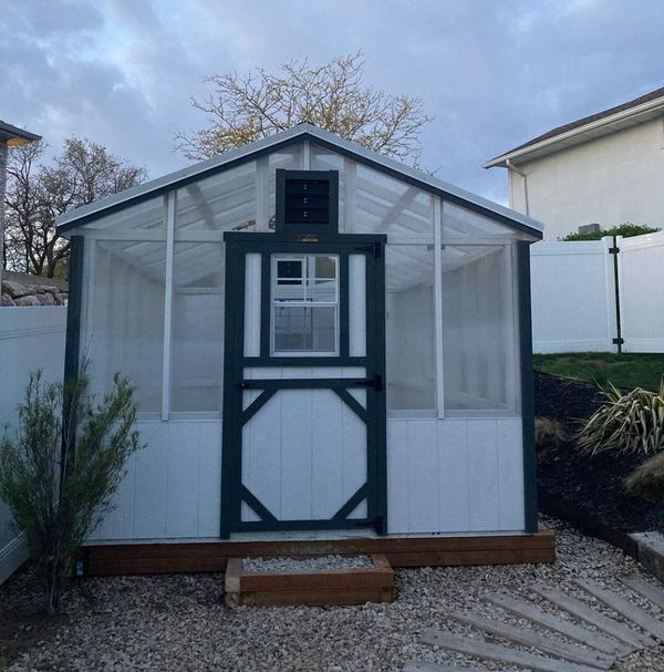 Montana Shed Center Greenhouse with electric fans on gravel pad in Riverdale, Utah