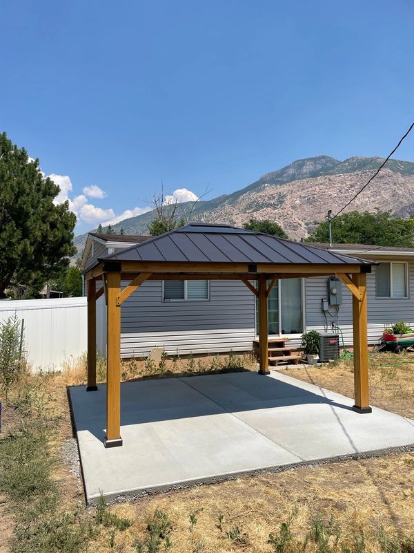 Sunjoy Hardtop Gazebo on concrete slab for backyard bbq area in Ogden, Utah