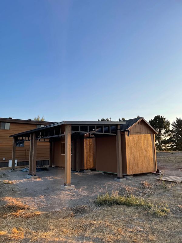 Yardistry 12x14 Contemporary Gazebo next to sheds and tiny home in Pocatello, Idaho