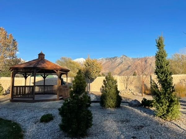 CountryLane Gazebos Octagon Gazebo with deck floor and cedar shake roof in Alpine, Utah