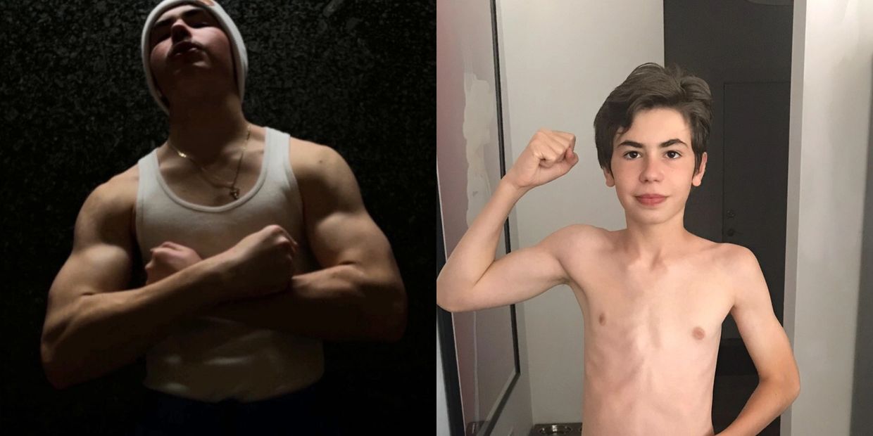 Two young males flexing muscles in contrasting lighting.