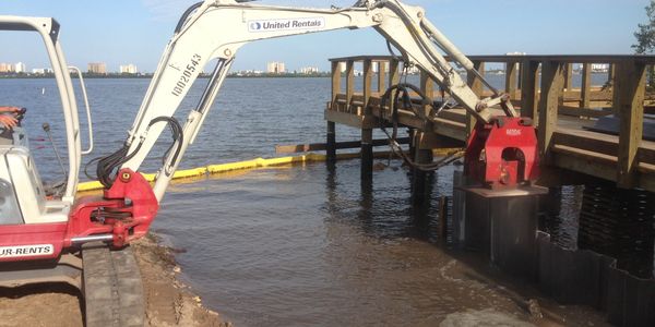 AVS Marine expertly installing sheet piling with hydraulic precision for waterfront stabilization at Halifax Harbor. 