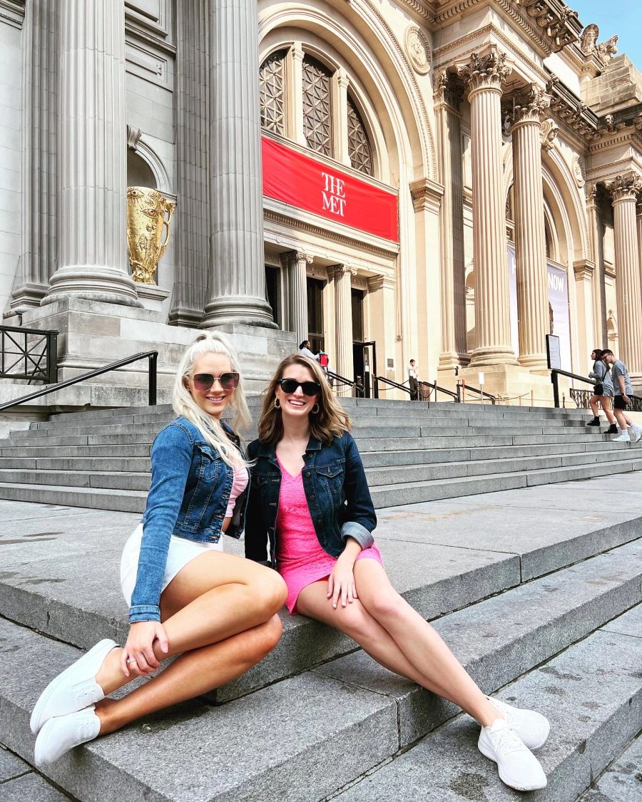 Two guests seated on the Met steps on a Gossip Girl Tours NYC tour