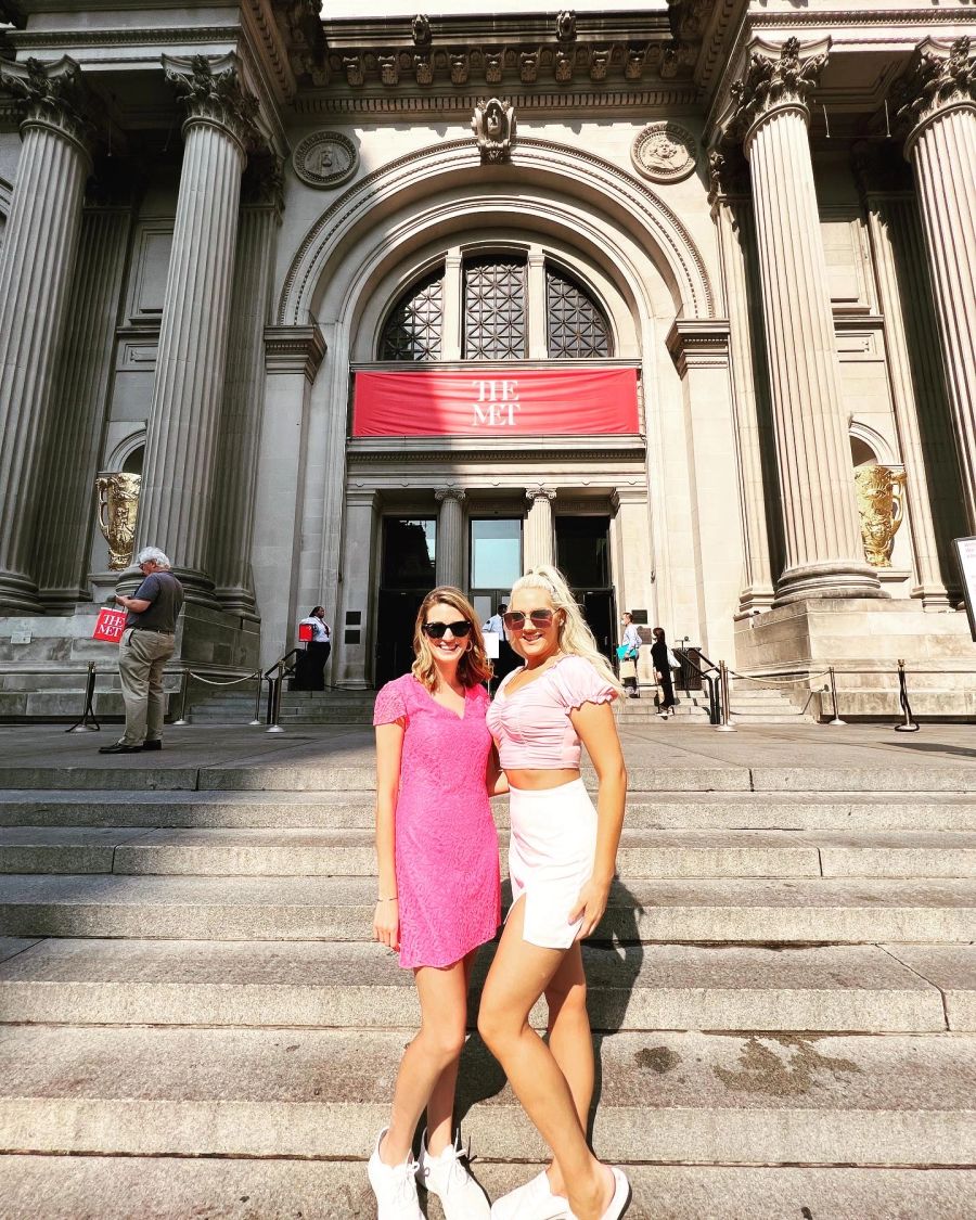Guests in pink outfits on the Met steps with Gossip Girl Tours NYC