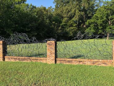 Private commission for steel fence panels to fit within existing brick fence.