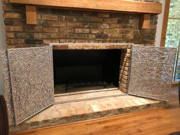 Custom fireplace screen created by Tamara Robertson.