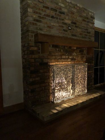 Custom fireplace screen created by Tamara Robertson.