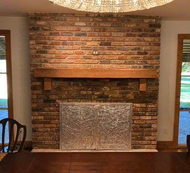 Custom fireplace screen created by Tamara Robertson.