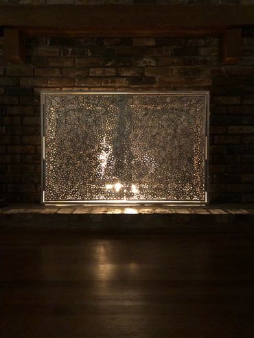 Custom fireplace screen created by Tamara Robertson.