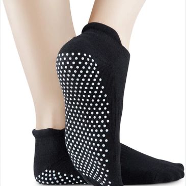 Black non-slip socks with white grip dots on soles.