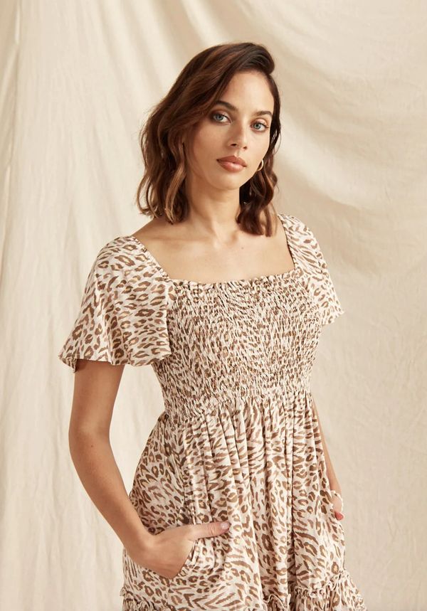 Woman wearing a leopard print dress