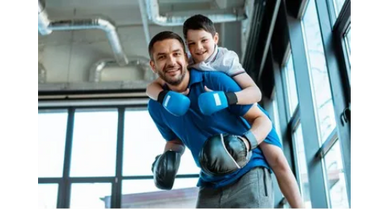 A father and son boxing training together