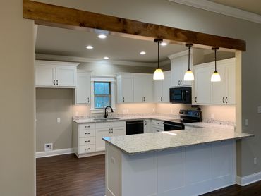 Custom kitchen. Granite countertops. Butler pantry. kitchen lighting. Stainless steel appliances.