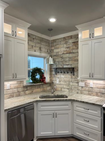 Custom kitchen. Granite countertops. Kitchen backsplash. kitchen lighting. Stainless appliances.