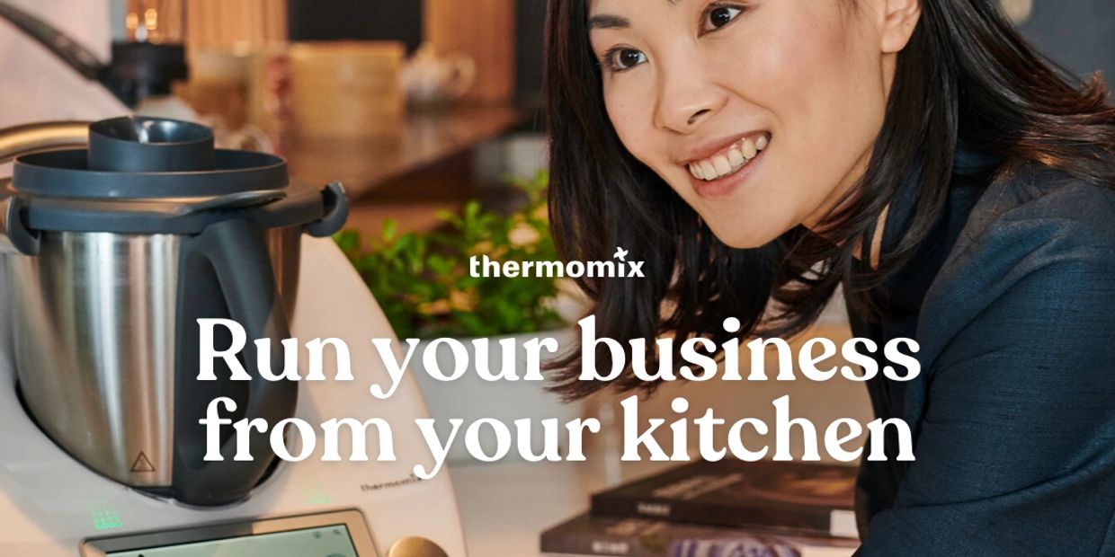 Lady smiling with her TM6. Words on picture say "Run your business from your kitchen."