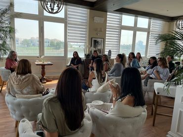Group of women gathered in a cozy room for a discussion or meeting.