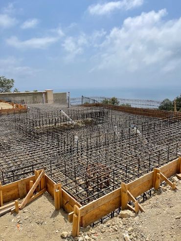 Luxury home swimming pool construction overlooking the water